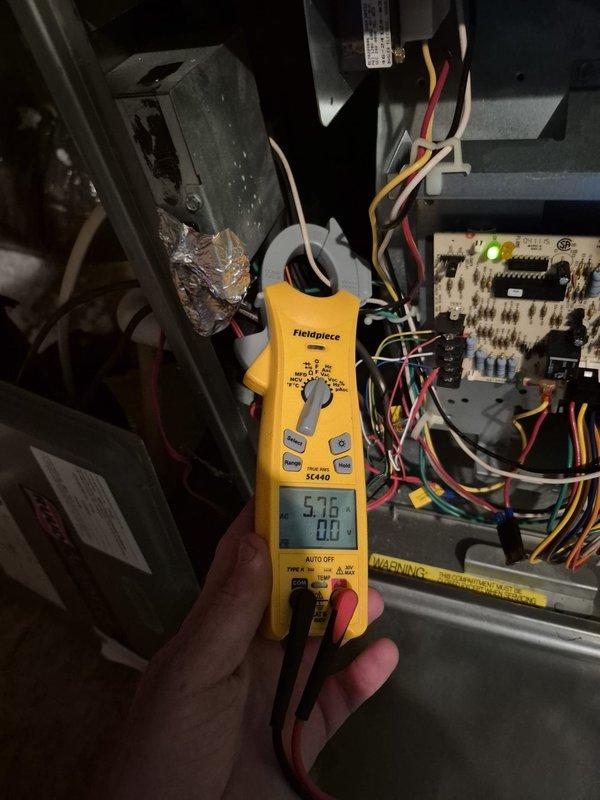 Completed preventive maintenance cooling visit on two HVAC systems. Performed comprehensive system diagnostics including electrical testing of control boards and components, verified proper voltage readings at 9.18V on circuit board connections, and measured supply air temperature at 32.4°F to confirm adequate cooling performance. Inspected blower assemblies, electrical connections, and control wiring throughout both units. All systems operating within normal parameters with no deficiencies noted.
