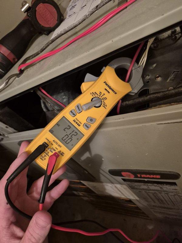 Completed cooling maintenance visit on two HVAC systems. Performed electrical diagnostics using digital multimeter, recording voltage readings of 36.9V and 24.8V at various terminal points within the units. Discussed thermostat upgrade options with customer and recommended obtaining replacement estimate proactively before peak cooling season to avoid emergency situations.