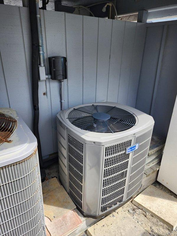 Completed full HVAC system upgrade, converting existing straight AC system to heat pump configuration. Removed and disposed of old equipment, then installed American Standard 5A6H4024A1000A 2-ton 14 SEER heat pump outdoor unit, American Standard 5TEM4B03AC31 air handler, American Standard BAYHTR1510 10 kW electric heat pack, and American Standard BAYSF1185 18.5" filter rack. Fabricated and installed metal duct transitions to adapt new equipment to existing ductwork. Replaced outdoor disconnect and electrical whip while reusing existing electrical connections, condensation lines, and power lines. Positioned outdoor unit on existing concrete pad. Reused existing thermostat previously installed by our company. System tested and verified operational with one-year platinum warranty coverage from installation date.