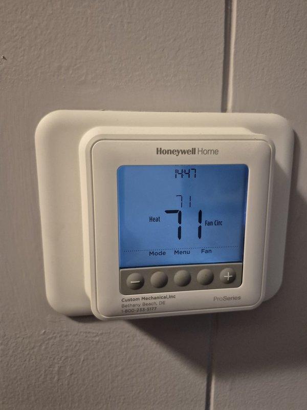# HVAC Maintenance - Heating System Service

Performed routine heating maintenance visit on residential HVAC system. Verified thermostat operation and confirmed system settings, with unit displaying 71°F in heating mode with fan circulation active. Measured electrical current draw at 17.2 amps using clamp meter to verify proper system operation and ensure equipment is functioning within normal parameters.