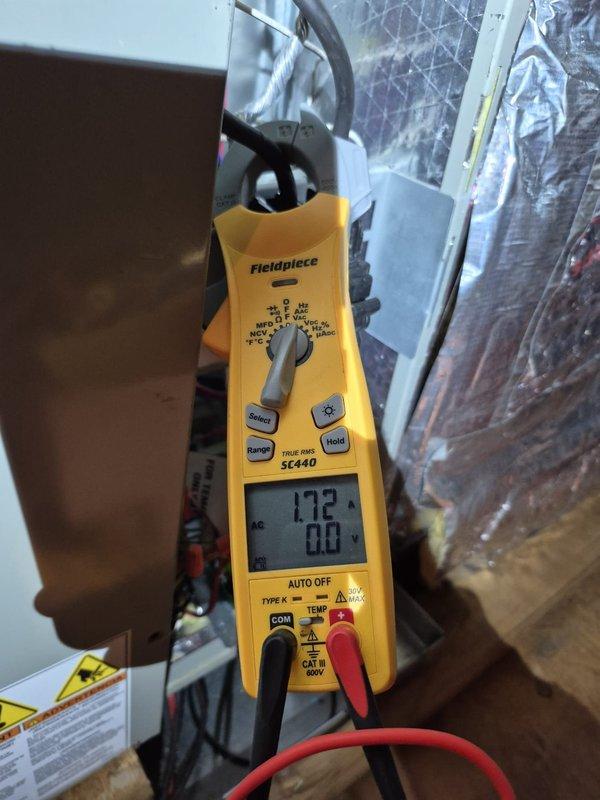 # HVAC Maintenance - Heating System Service

Performed routine heating maintenance visit on residential HVAC system. Verified thermostat operation and confirmed system settings, with unit displaying 71°F in heating mode with fan circulation active. Measured electrical current draw at 17.2 amps using clamp meter to verify proper system operation and ensure equipment is functioning within normal parameters.