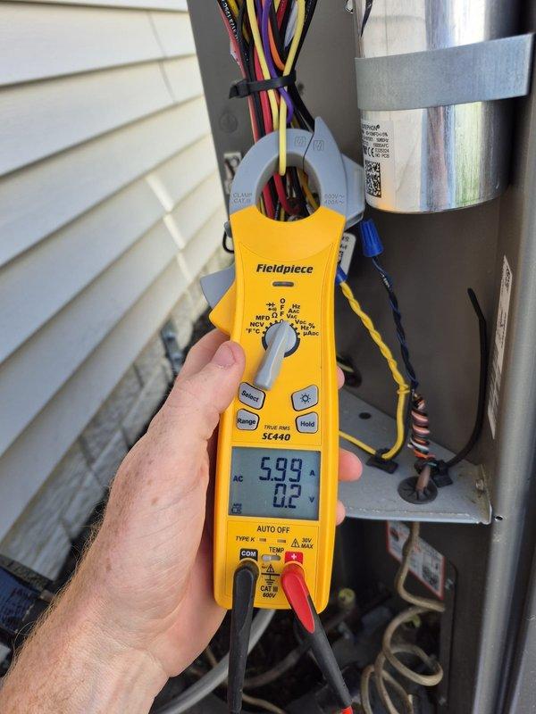 Completed system inspection and tune-up under savings agreement. Serviced and flushed Broan ERV unit and replaced air filter. Verified system operation with ecobee thermostat displaying proper temperature settings and performed electrical diagnostics on outdoor condensing unit, confirming appropriate amperage draw of 5.99A.