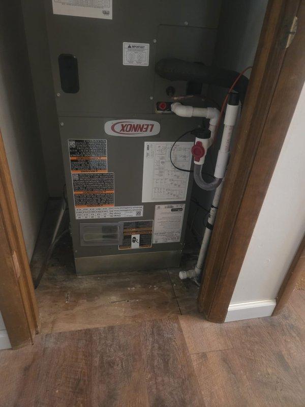 Completed full HVAC system replacement on right side of home, removing and disposing of existing equipment. Installed Lennox ML14-KP1-024 2-ton heat pump with Lennox CBK45UHET-024 air handler in interior mechanical closet configured for downflow application. Integrated 10kW electric heat kit for supplemental heating capacity. Fabricated and installed metal duct transitions to adapt new equipment to existing ductwork system. Reused existing refrigerant lines and condensate drainage infrastructure. Replaced outdoor disconnect and electrical whip to meet current code requirements. Removed pavers at outdoor unit location and mounted heat pump on snow legs for proper elevation and drainage. Installed Honeywell WiFi-enabled digital thermostat for system control and remote access capability. Verified all electrical connections, refrigerant charge, airflow, and system operation. System tested and confirmed operational with proper heating and cooling functionality.