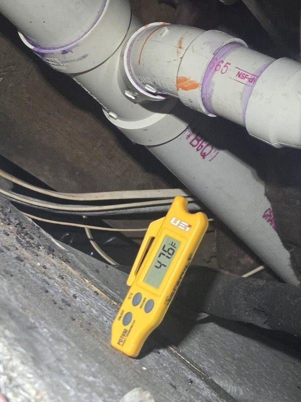 # HVAC Maintenance - Cooling System Service

Completed routine cooling maintenance visit on residential HVAC system. Performed comprehensive electrical diagnostics using clamp meter, recording amperage draw of 15.1 amps on compressor circuit, which falls within normal operating parameters. Conducted refrigerant line temperature verification using digital thermometer, measuring 97.4°F on liquid line, indicating proper system charge and heat rejection. Inspected PVC condensate drain lines for proper flow and verified all connections secure with no signs of leakage. System operating efficiently with all electrical components functioning within manufacturer specifications.
