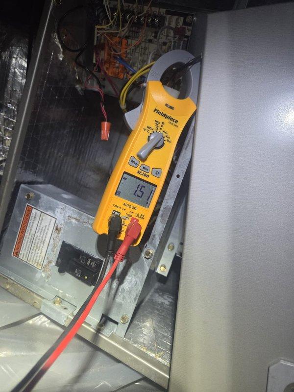 # HVAC Maintenance - Cooling System Service

Completed routine cooling maintenance visit on residential HVAC system. Performed comprehensive electrical diagnostics using clamp meter, recording amperage draw of 15.1 amps on compressor circuit, which falls within normal operating parameters. Conducted refrigerant line temperature verification using digital thermometer, measuring 97.4°F on liquid line, indicating proper system charge and heat rejection. Inspected PVC condensate drain lines for proper flow and verified all connections secure with no signs of leakage. System operating efficiently with all electrical components functioning within manufacturer specifications.