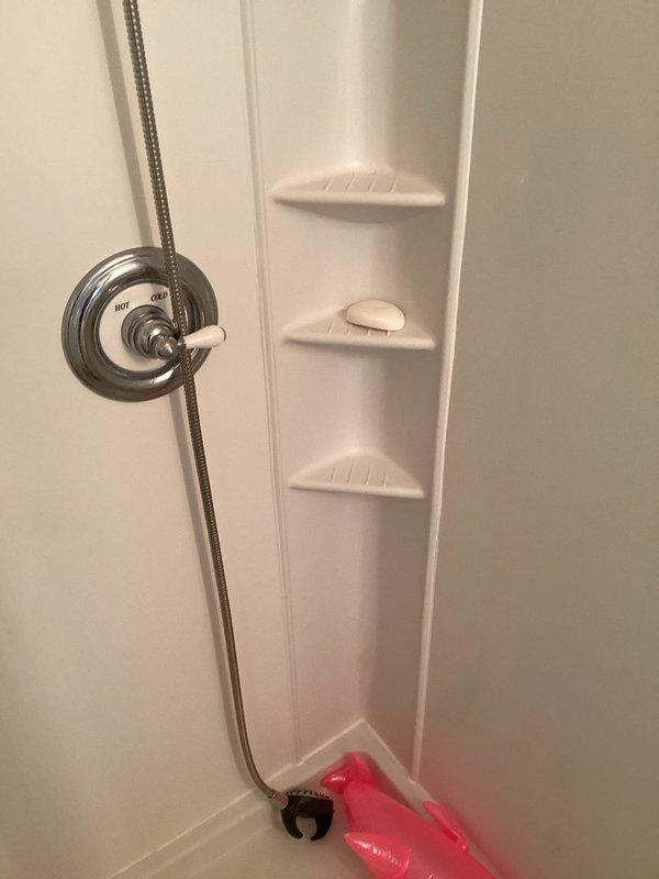 Provided estimate for replacement of existing standard height toilet with new regular height elongated bowl toilet. Assessed second floor shower enclosure and glass area for caulking needs to address potential water intrusion concerns at wall joints and fixture penetrations.