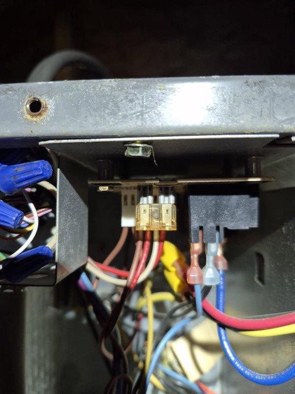 Performed scheduled cooling maintenance visit on HVAC system with significant age-related deterioration. Upon inspection, found extensive rust and corrosion on air handler cabinet and internal components, with accumulated dust and debris throughout the unit. Conducted electrical diagnostics using clamp meter, measuring voltage and amperage at capacitor and wire connections. Verified proper electrical connections at fuse block and terminal connections, noting multiple wire bundles secured with proper strain relief. All electrical components tested within operational parameters despite visible wear on equipment housing. System operational at time of departure, though equipment shows advanced aging with surface oxidation on metal panels and cabinet framework.