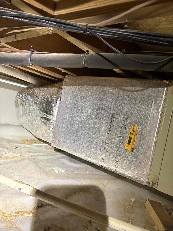 Completed cooling system inspection and tune-up on Carrier air handler unit located in crawl space. Performed comprehensive system evaluation including inspection of ductwork, electrical connections, condensate drainage lines, and unit operation per maintenance contract requirements. All components found to be functioning within normal parameters, with photos documented for service records.