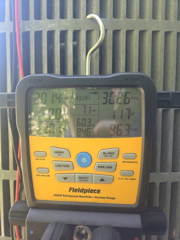 Performed preventive maintenance on cooling system. Utilized Fieldpiece SMAN refrigerant manifold and digital gauges to measure system pressures and temperatures, verifying proper refrigerant charge and system operation. All readings within manufacturer specifications, unit operating normally.