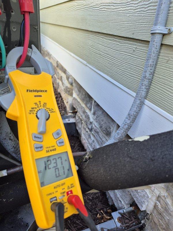 Performed semi-annual HVAC maintenance on cooling system, including electrical diagnostics with capacitor testing showing proper readings and refrigerant line inspection. Adjusted manual zone dampers to optimize seasonal airflow distribution throughout the zoned system, ensuring balanced comfort and efficient operation for the cooling season.