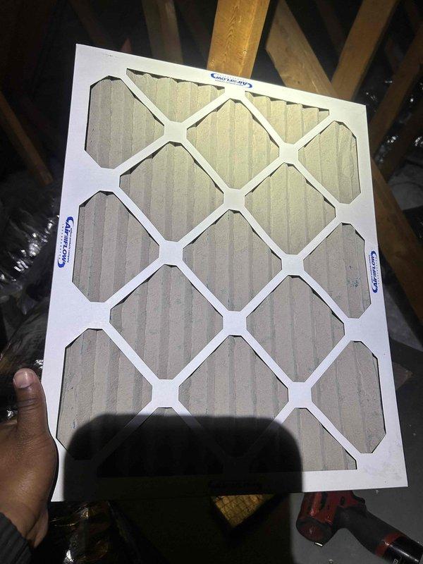 Performed routine spring maintenance on residential cooling system. Accessed unit using office key as requested. Inspected and documented dirty air filter showing moderate dust accumulation, particularly in lower section, requiring replacement for optimal airflow and system efficiency. Verified Emerson programmable thermostat operation and PIN-protected settings functioning properly. System operating normally at time of service with no immediate concerns identified.