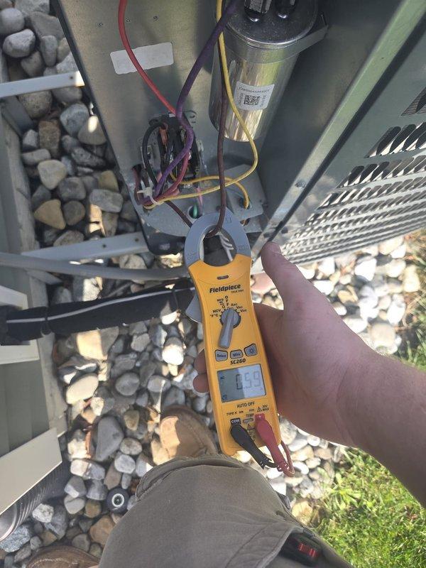 Completed routine cooling maintenance visit on outdoor condensing unit. Performed electrical diagnostics using clamp meter, verifying capacitor operation and measuring voltage readings at 402V. Tested compressor amperage draw and confirmed all electrical connections are secure and within manufacturer specifications. Inspected condenser coil, fan motor operation, and overall system performance. Unit operating properly with no issues found.