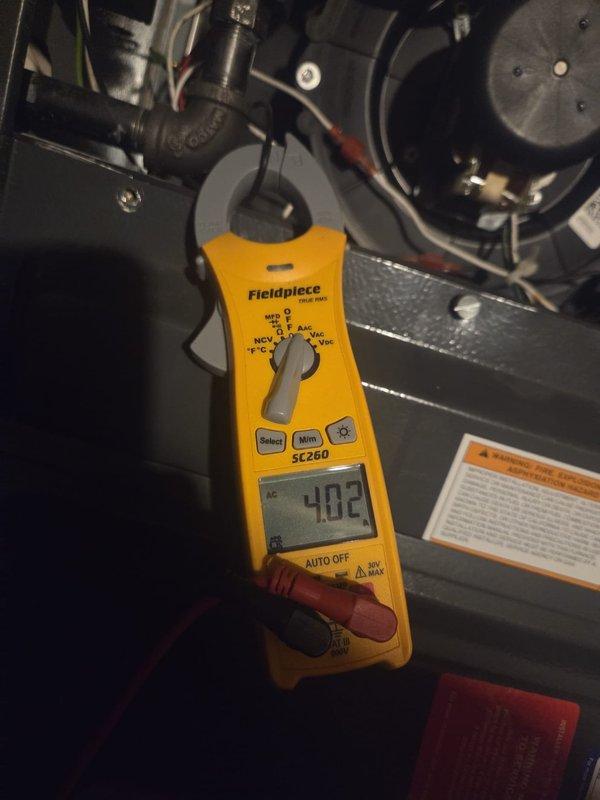 Completed routine cooling maintenance visit on outdoor condensing unit. Performed electrical diagnostics using clamp meter, verifying capacitor operation and measuring voltage readings at 402V. Tested compressor amperage draw and confirmed all electrical connections are secure and within manufacturer specifications. Inspected condenser coil, fan motor operation, and overall system performance. Unit operating properly with no issues found.