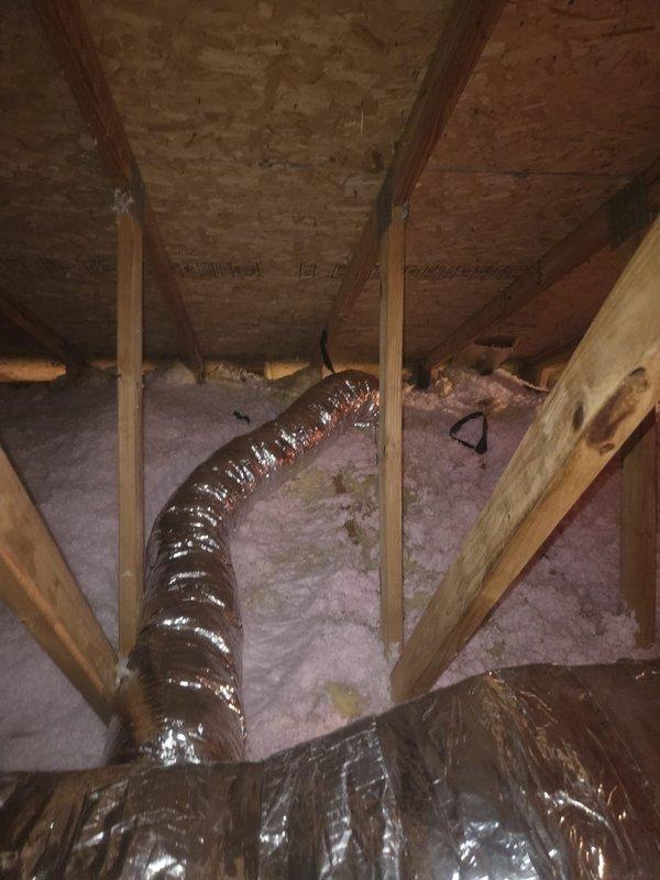 Removed and replaced animal-damaged ductwork in attic space with new insulated metal duct trunk lines and flexible branch runs equipped with balancing dampers. Existing HVAC equipment, metal boots, and registers were retained and reconnected to the new duct system. Installation completed per specifications with proper insulation and support throughout the attic space.