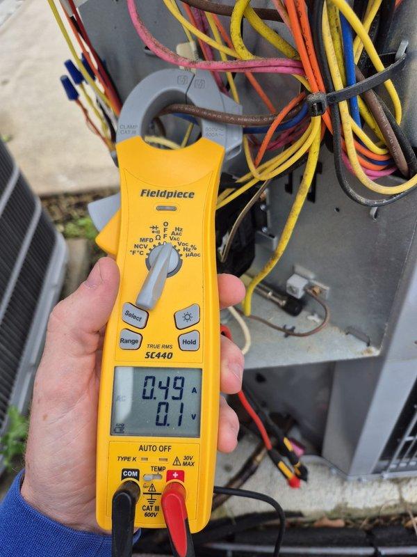 Completed cooling maintenance visit on upstairs system as follow-up to previous refrigerant and dye service. Inspected system for UV dye traces to verify leak repair integrity, performed electrical diagnostics using clamp meter to confirm proper system operation, and verified thermostat functionality showing 61°F display reading. System operating within normal parameters with no visible dye leaks detected at this time.