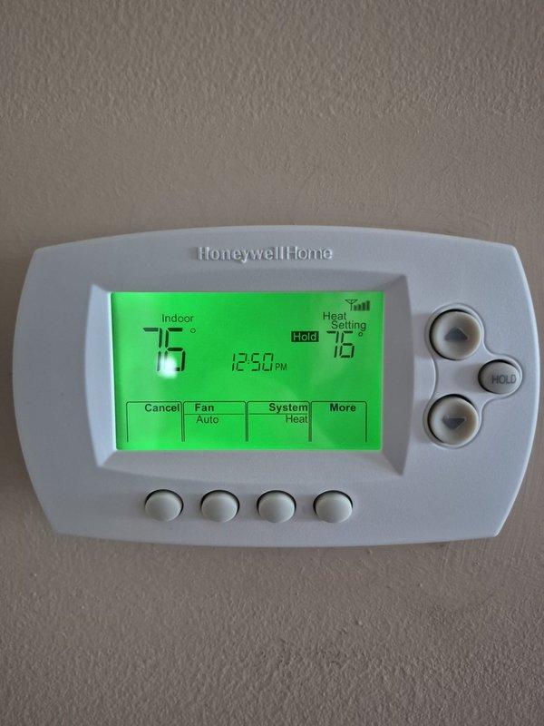 Completed routine cooling maintenance visit on two HVAC systems. Verified thermostat operation showing 75°F indoor temperature with proper display function and control response. Measured supply air temperature at 55°F, confirming adequate cooling performance and system operation within normal parameters.