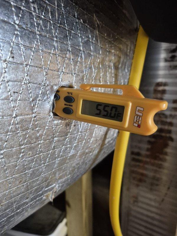 Completed routine cooling maintenance visit on two HVAC systems. Verified thermostat operation showing 75°F indoor temperature with proper display function and control response. Measured supply air temperature at 55°F, confirming adequate cooling performance and system operation within normal parameters.