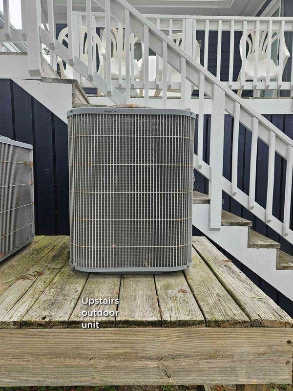 Completed scheduled cooling maintenance visit on dual-system HVAC setup, servicing both the indoor air handler unit located in basement utility space and the upstairs outdoor condenser unit positioned on deck. Performed standard preventive maintenance procedures including filter inspection, system operation verification, and visual equipment assessment. Noted extra filters available in garage for future use.