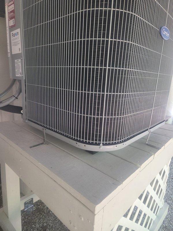 Returned to complete warranty work by replacing galvanized mounting brackets with stainless steel brackets on the air handler per homeowner specifications. Coordinated outdoor unit removal to allow third-party contractor access for wooden platform repair, then reinstalled the Carrier 3-ton heat pump condensing unit once stand work was completed. Re-routed flex ductwork to improve airflow distribution to bedroom while maintaining proper connection to the existing duct system.