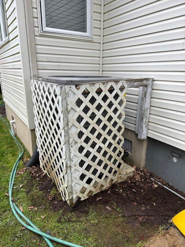 Completed full removal and replacement of dual HVAC systems at residential property. Removed and properly disposed of existing equipment from both zones. Installed 4-ton 14 SEER heat pump model 5A6H4048 with variable speed fan coil unit model 5TEM6D05, equipped with 15KW backup heater and breaker. Installed 2.5-ton 14 SEER heat pump model 5A6H4030 with variable speed fan coil unit model 5TEM6B02, equipped with 10KW backup heater and breaker. Mounted outdoor units on elevated platforms for proper drainage and airflow. Fan coil units installed in drain pans with integrated shut-off valves for maintenance accessibility. Installed electrical whips and disconnect boxes at each outdoor unit location per code requirements. Flushed existing refrigeration lines, performed pressure testing to verify system integrity, and recharged to manufacturer specifications. Installed 1-inch filter racks on both systems for improved filtration. Mounted Honeywell T-6 non-programmable thermostats with wall pla