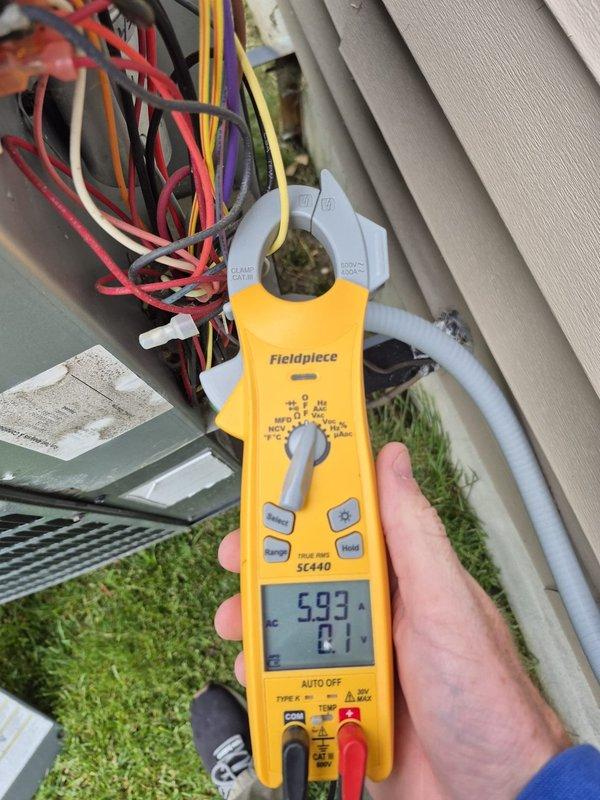Performed preventive maintenance cooling visit on residential HVAC system. Conducted electrical diagnostics using clamp meter at outdoor condensing unit, measuring amperage draw and verifying proper electrical operation across multiple wire connections. Verified thermostat operation and system settings, confirming proper communication between indoor controls and outdoor equipment for upcoming cooling season.