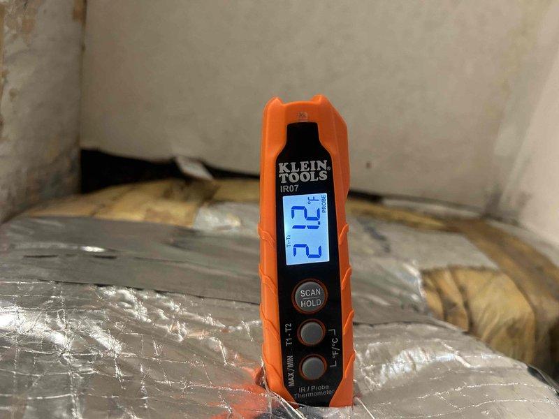 Responded to service call for lower floor HVAC unit not responding on mobile application. Performed diagnostic inspection using thermal imaging camera to scan electrical panel and circuit breakers, identifying no abnormal heat signatures or electrical issues. Measured supply duct temperatures with infrared thermometer to verify system operation. Determined unit was functioning properly with no mechanical or electrical faults; connectivity issue was related to WiFi/network configuration rather than HVAC equipment malfunction.