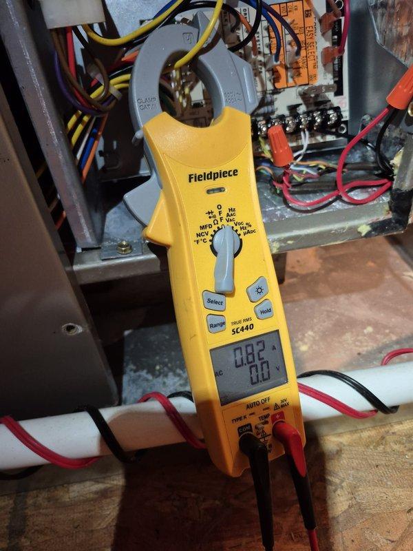 Performed cooling system tune-up and maintenance check on residential HVAC unit. Verified thermostat operation showing system cooling to 73°F setpoint with fan in auto mode. Took electrical measurements using clamp meter at control board, confirming proper amperage draw and system performance. Replaced 16x25x4 air filter as part of routine maintenance to ensure optimal airflow and system efficiency.