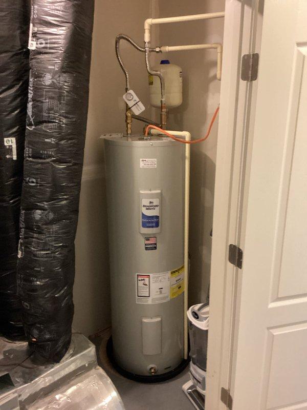 Installed Cash Acme mixing valve on water heater piping system. Part was previously ordered and picked up from warehouse counter. Installation completed in approximately 90 minutes, including integration with existing white PVC supply lines and brass fittings mounted above the water heater unit.