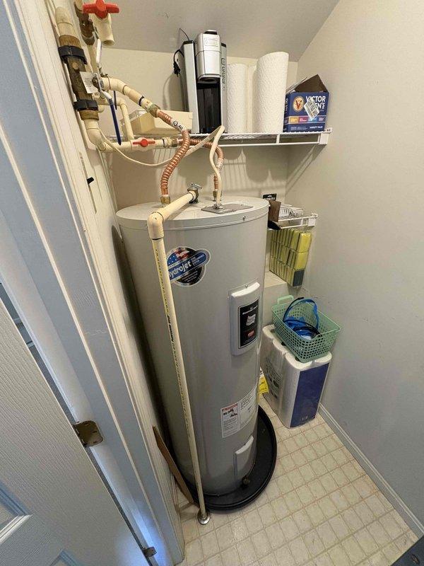 Responded to service call for system inspection after customer replaced thermostat on recently purchased property. Upon arrival, discovered customer concern was related to water heater, not HVAC system. Inspected Bradford White automatic storage water heater model M250R6DS (50-gallon capacity, 240V, dual 4500-watt elements) located in utility closet. Verified unit operational status, confirmed proper electrical connections, checked temperature/pressure relief valve, and inspected plumbing connections including copper flex lines and PVC piping with shut-off valve. Documented equipment with photos for service records. No HVAC system inspection performed as originally requested equipment was not present at service location.