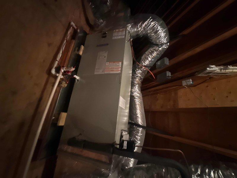 Removed and disposed of existing HVAC system from left side attic. Installed 4-ton 17 SEER heat pump outdoor unit on existing stand and variable speed fan coil unit in drain pan with shutoff valve in attic. Installed 15KW electric heater with breaker, 1-inch filter rack, and two Honeywell Wi-Fi thermostats. Flushed, pressure tested, and recharged refrigerant lines with insulated copper piping. Connected unit to existing zone board and damper system. All equipment installed per manufacturer specifications and tested for proper operation.