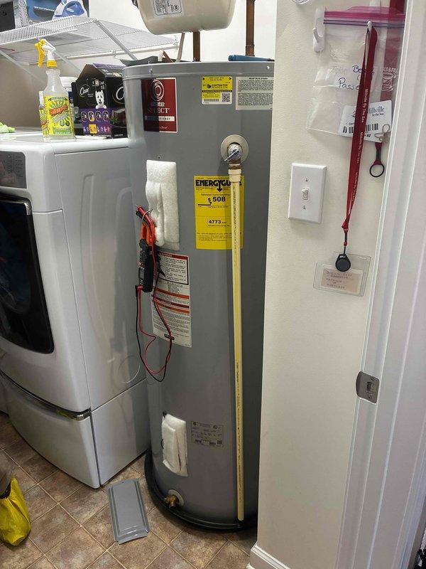 Completed routine maintenance visit on residential tanked water heater. Performed comprehensive inspection of unit, including pressure relief valve, temperature settings, and all plumbing connections. Verified proper clearances around unit (23" width, 60" height), confirmed adequate spacing from adjacent washing machine, and documented all safety labels and energy guide information present and legible. All components operating within normal parameters with no leaks detected at connections or tank body.