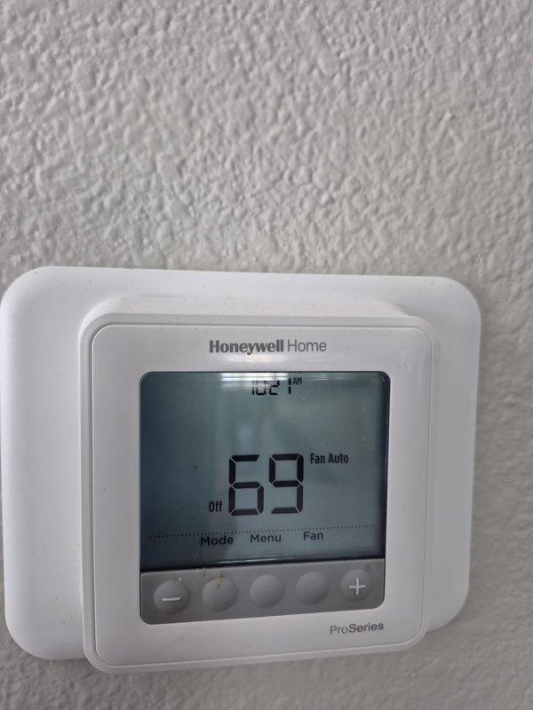Completed scheduled cooling maintenance visit on residential HVAC system. Performed comprehensive system inspection including electrical testing of outdoor unit components using digital multimeter, verifying capacitor operation and electrical connections. Confirmed thermostat functionality showing system set to 69°F in off mode with fan set to auto. All components operating within normal parameters with no deficiencies noted.
