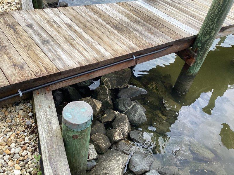 Completely repiped freeze-damaged dock water service line using 50 feet of 3/4" black poly tubing, brass male adapters, couplings, nipple, drop ear elbow, and boiler drain. Replaced corroded gas fittings and installed 15-foot gas quick disconnect line with new fittings for upper deck gas connection.