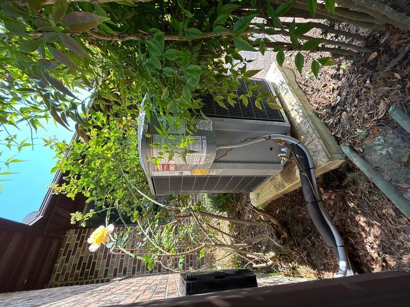 Completed full HVAC system replacement including removal and disposal of existing equipment. Installed new Carrier 59SC2E100M21 92% AFUE gas furnace with LP conversion kit, Carrier 26SCA560W003 5-ton 15 SEER air conditioning condenser, and Carrier CAAMP6121AMA evaporator coil. Fabricated and installed metal duct transitions to adapt new equipment to existing ductwork. Reused existing condensate drain lines while replacing outdoor electrical disconnect and electrical whip for code compliance. Constructed pressure-treated wood platform and positioned outdoor condenser unit with proper clearances. Installed Honeywell digital WiFi thermostat for system control. Tested all system functions including heating and cooling cycles, verified proper refrigerant charge, confirmed adequate airflow, and ensured all electrical connections meet manufacturer specifications.