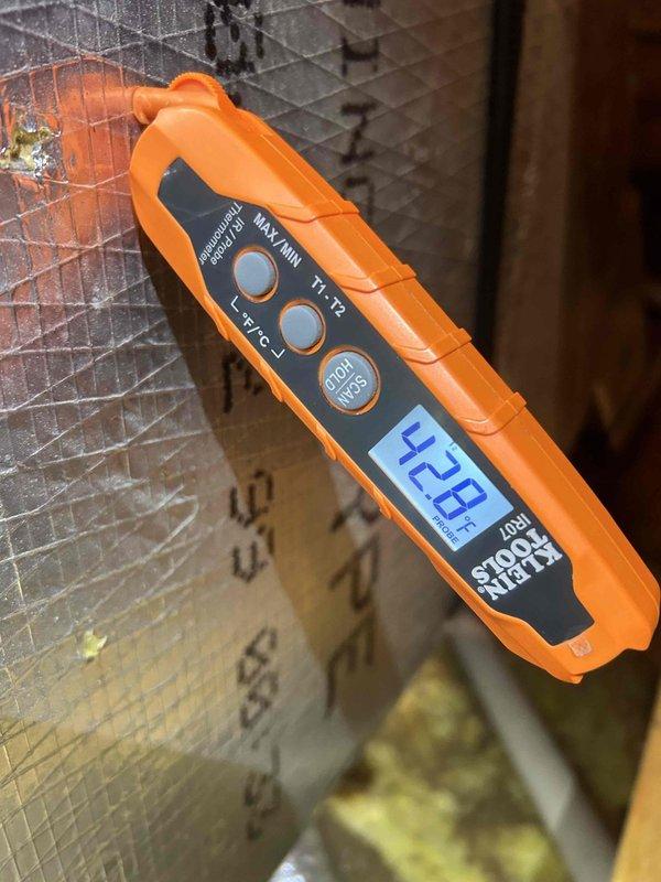 Responded to a system with inadequate cooling performance. Upon arrival, diagnosed low refrigerant charge indicated by a 9-degree temperature split across the evaporator coil. Added 4 ounces of R-410a refrigerant with UV dye to the system, which improved suction pressure to 177 PSI. Temperature readings confirmed restricted refrigerant flow through the evaporator coil. Further diagnosis identified a faulty thermostatic expansion valve (TXV) requiring replacement. Ordered replacement TXV part number D346317P49 for follow-up repair visit. System requires TXV replacement and completion of maintenance service to restore proper cooling capacity. Unit total refrigerant capacity is 9.6 pounds of R-410a excluding line set volume.