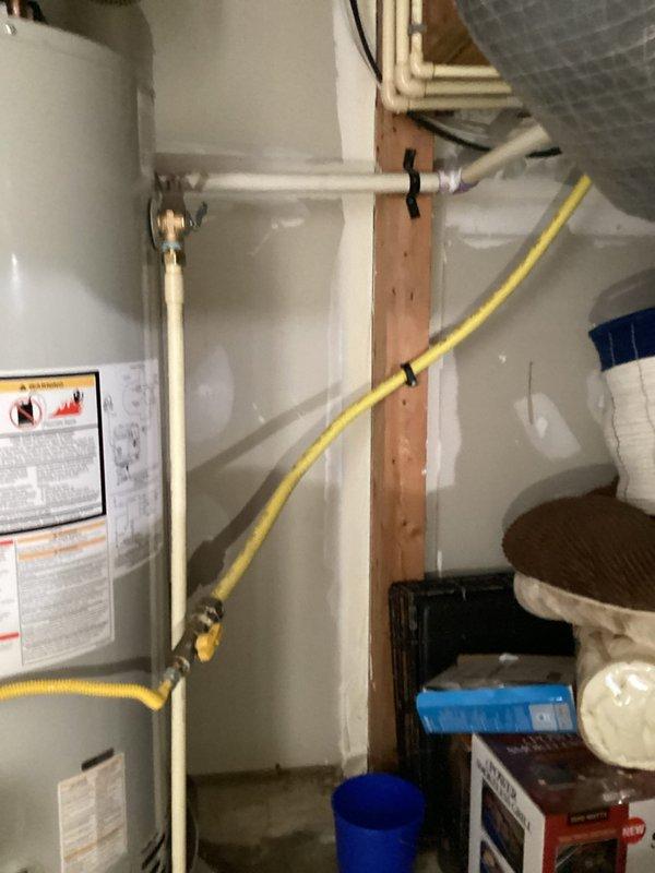 Installed a 50-gallon Bradford White power vent water heater (model RG1PV50S6X1) in the utility area. Installation included a 24-inch drain pan, thermal expansion tank, brass fittings (3/4" x 2" nipple, 3/4" x 6" nipple, 3/4" tee, and 3/4" 90-degree elbow), and two 18-inch flexible water connectors. Connected gas supply line, water supply lines, and venting system, ensuring all components meet code requirements and manufacturer specifications.