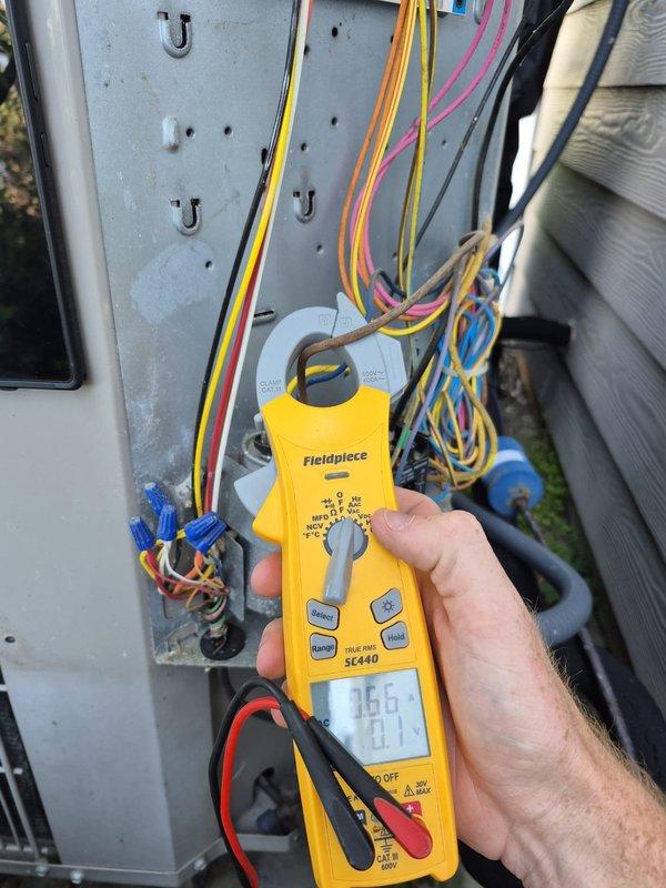Performed routine cooling maintenance visit on residential HVAC system. Conducted electrical diagnostics using clamp meter, verifying amperage readings at outdoor unit disconnect panel showed 366 amps, and confirmed proper operation with 0.0 reading at indoor air handler. All electrical connections, wiring, and components inspected and found to be in proper working condition.