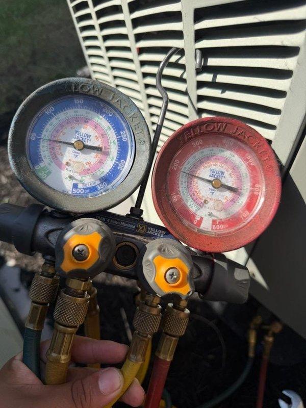 Responded to no cooling complaint on upstairs unit. Upon arrival, verified system was not producing cool air. Connected refrigerant manifold gauges to service ports and checked system pressures. Based on gauge readings and visual inspection of the equipment (assembled in USA, model 390F), diagnosed and addressed the cooling issue. System restored to proper operation with adequate airflow through supply registers.
