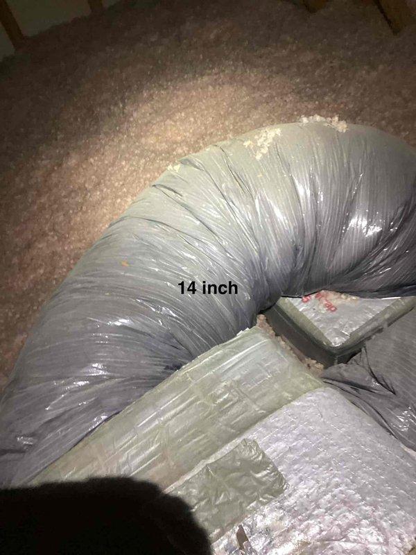 Responded to no cooling call with thermostat set to 77°F but reading 84°F. Inspected outdoor condensing unit and verified equipment specifications on manufacturer label showing 105 LRA and 24 HP ratings. Documented 14-inch flexible supply duct routing through attic space with fiberglass insulation and confirmed proper installation of HVAC system components for outdoor use.