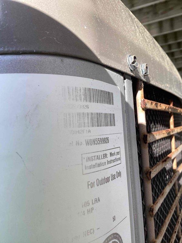 Responded to no cooling call with thermostat set to 77°F but reading 84°F. Inspected outdoor condensing unit and verified equipment specifications on manufacturer label showing 105 LRA and 24 HP ratings. Documented 14-inch flexible supply duct routing through attic space with fiberglass insulation and confirmed proper installation of HVAC system components for outdoor use.
