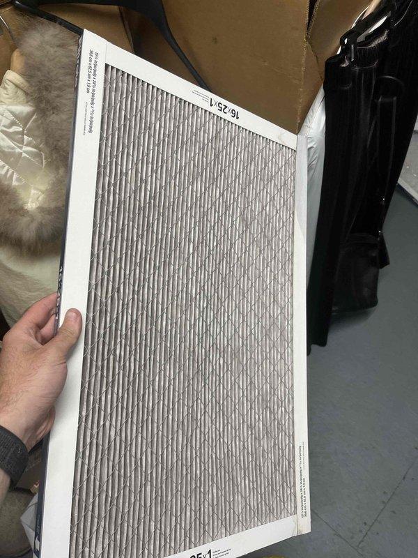 Responded to no cooling call for upstairs system with thermostat set to 72°F but reading 80°F. Inspected system and found severely clogged air filter restricting airflow, which was replaced. Examined refrigerant line penetration through roof membrane and noted existing weatherproofing with foam sealant and metallic flashing tape in acceptable condition. System restored to proper cooling operation after filter replacement.