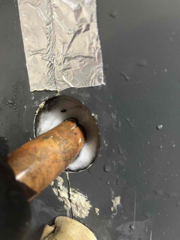 Responded to no cooling call for upstairs system with thermostat set to 72°F but reading 80°F. Inspected system and found severely clogged air filter restricting airflow, which was replaced. Examined refrigerant line penetration through roof membrane and noted existing weatherproofing with foam sealant and metallic flashing tape in acceptable condition. System restored to proper cooling operation after filter replacement.
