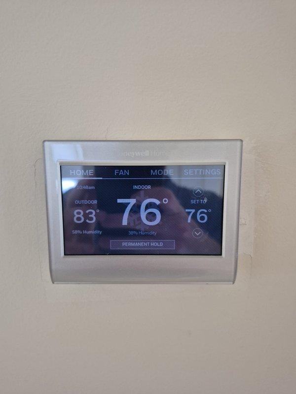 Completed scheduled cooling maintenance visit for multi-system HVAC installation. Performed comprehensive inspection and testing of all cooling equipment, verified proper operation of Honeywell Home smart thermostat with accurate temperature and humidity readings displaying 76° indoor setpoint with system actively cooling. Confirmed thermostat programming schedule functioning correctly with proper communication between control system and cooling units, all systems operating within normal parameters.