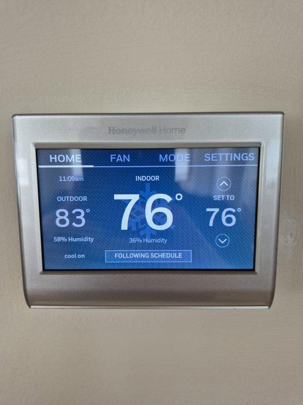 Completed scheduled cooling maintenance visit for multi-system HVAC installation. Performed comprehensive inspection and testing of all cooling equipment, verified proper operation of Honeywell Home smart thermostat with accurate temperature and humidity readings displaying 76° indoor setpoint with system actively cooling. Confirmed thermostat programming schedule functioning correctly with proper communication between control system and cooling units, all systems operating within normal parameters.