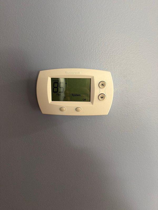Conducted scheduled appointment to finalize HVAC system replacement proposal with property owners. Documented existing equipment configuration including air handler unit located in mechanical room and Honeywell digital thermostat displaying 81°F. Reviewed replacement specifications with owners and obtained signed approval on proposal to proceed with new system installation. Prepared site assessment and photographic documentation of current equipment placement, ductwork connections, electrical controls, and thermostat location for pre-installation planning purposes.