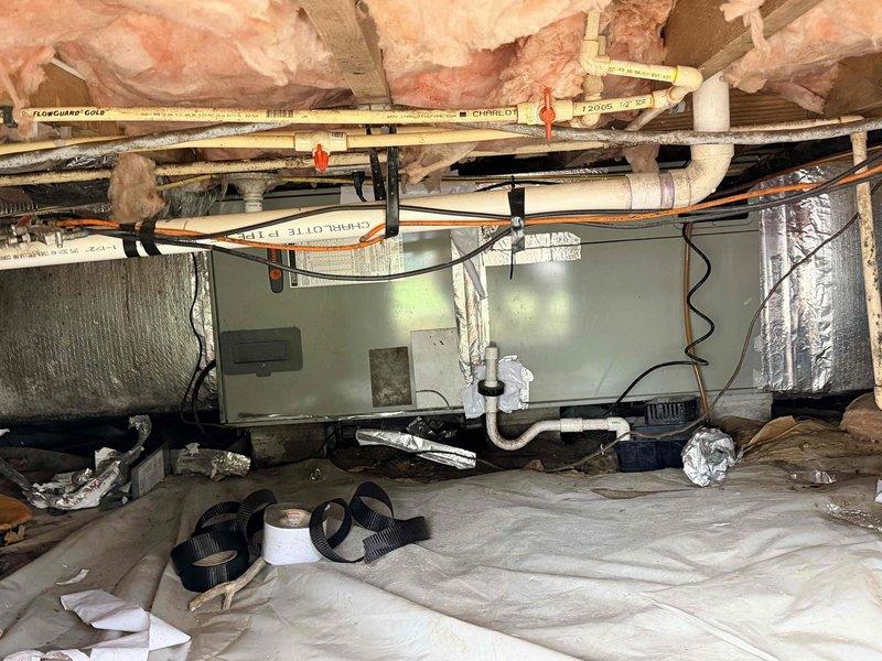 Conducted comprehensive system evaluation for complete HVAC replacement in crawlspace installation. Assessed existing air handler unit, ductwork configuration, and outdoor condensing unit to provide detailed estimate for full system replacement, documenting current equipment condition and installation requirements through photographic documentation.