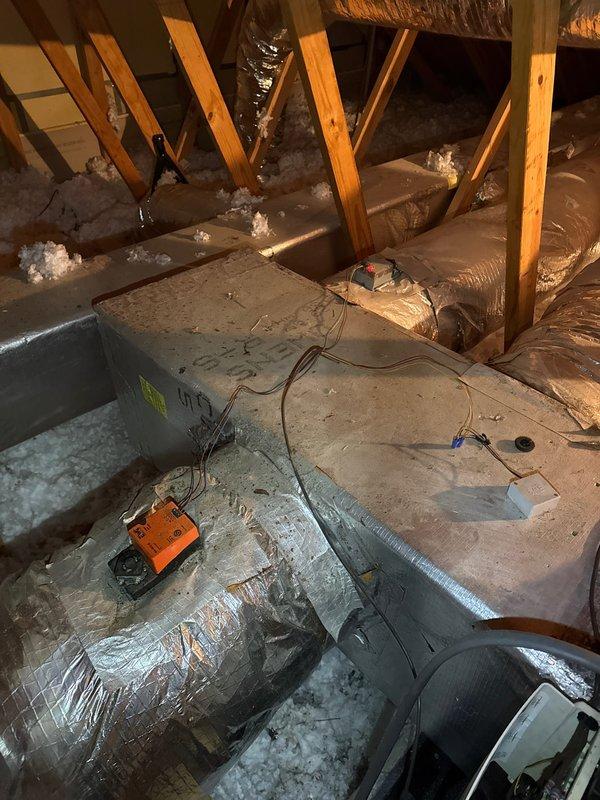 Performed comprehensive inspection and tune-up on two HVAC systems located in attic space. Evaluated air handler components, control boards, electrical connections, and ductwork integrity. All systems tested and found operating within normal parameters, with proper airflow through flexible duct runs and adequate insulation coverage maintained throughout installation area.