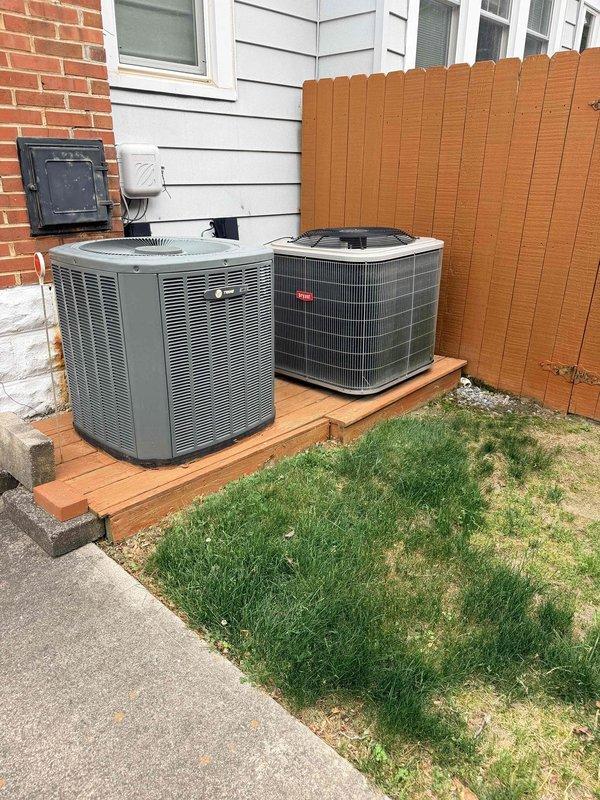 Completed HVAC estimate for replacement of existing 2-ton Trane system originally installed in 2009. Unit located in attic with access via second-floor ceiling requiring ladder access. Assessed current outdoor condenser positioned on wooden platform with brick wall mounting and evaluated replacement options for complete system upgrade.