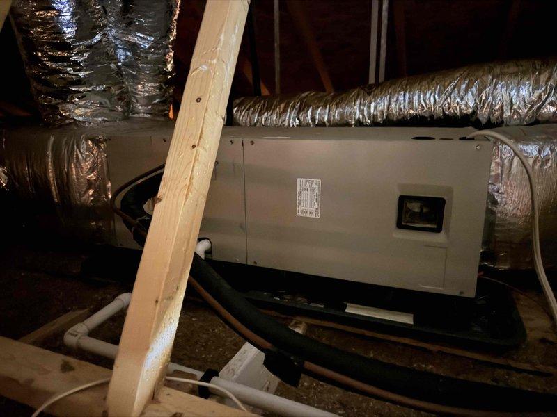 Provided estimate for HVAC system replacement in attic installation. Assessed existing air handler unit and ductwork configuration, documented current equipment specifications and installation conditions including flexible metallic ductwork, condensate drain pan, and PVC drain lines. Customer inquiry also included whole house surge protector installation options.