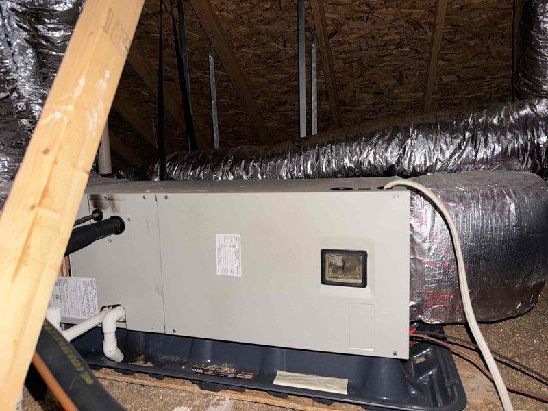 Provided estimate for HVAC system replacement in attic installation. Assessed existing air handler unit and ductwork configuration, documented current equipment specifications and installation conditions including flexible metallic ductwork, condensate drain pan, and PVC drain lines. Customer inquiry also included whole house surge protector installation options.